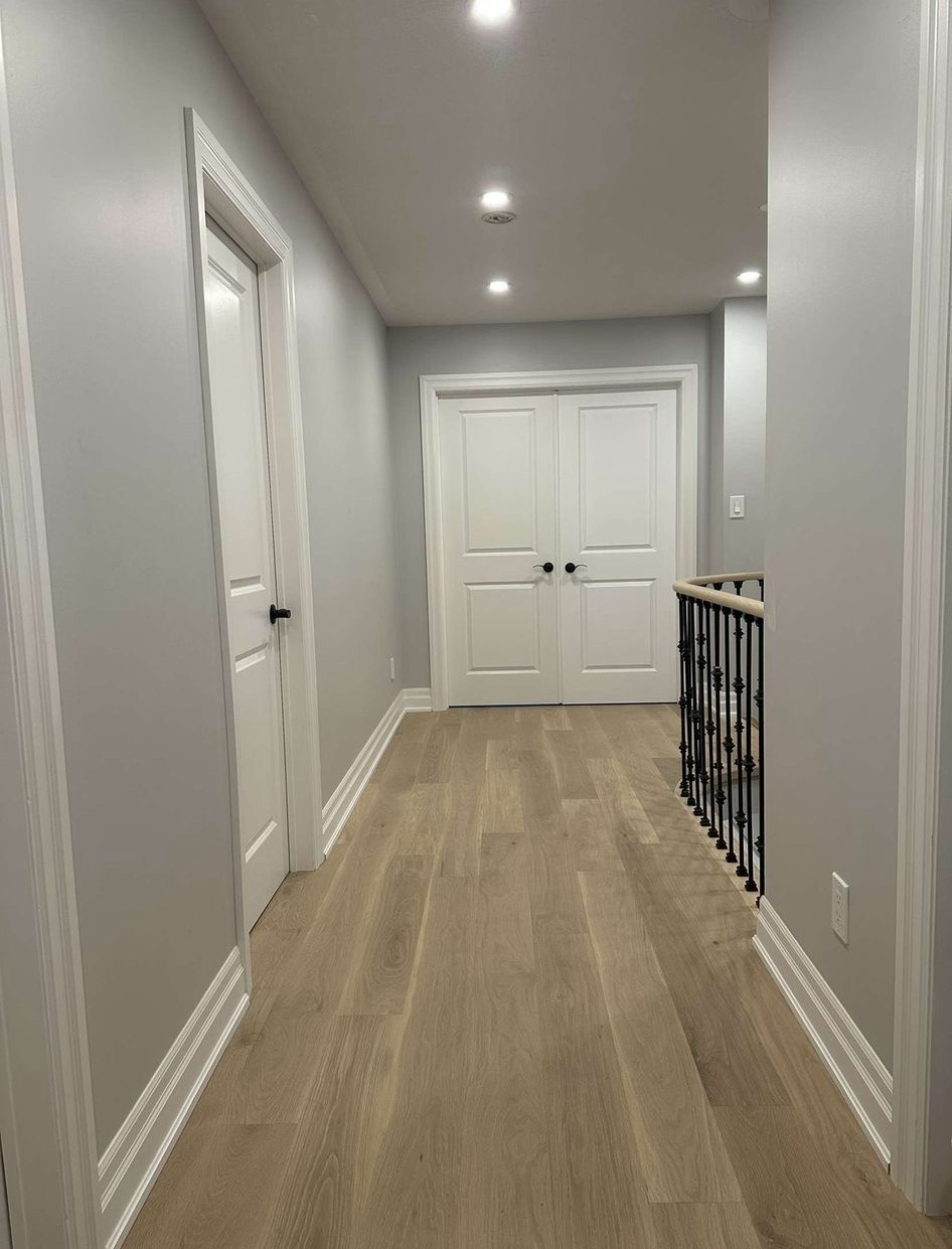 New hardwood flooring in a finished upstairs hallway, Toronto