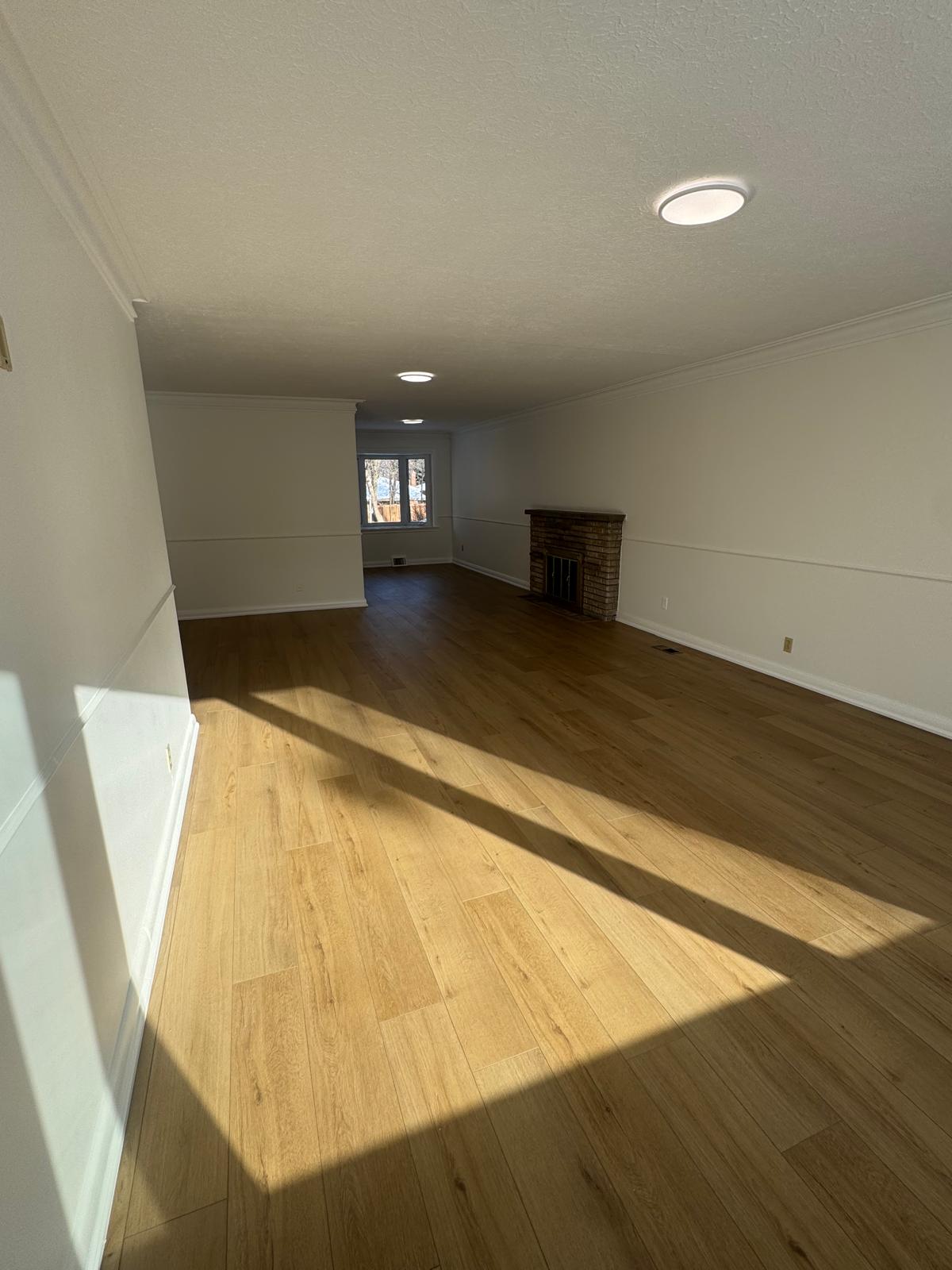 Open concept main floor with hardwood flooring installed in Toronto home