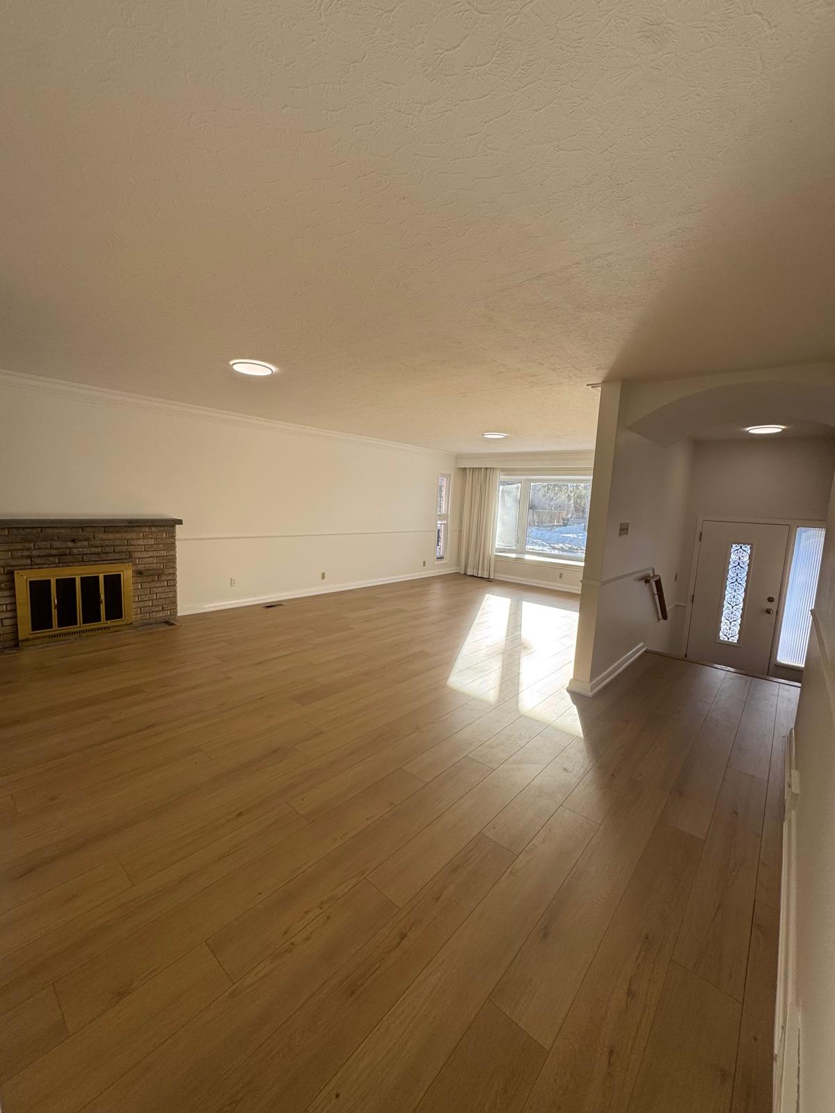 Laminate flooring installed in Toronto living room renovation